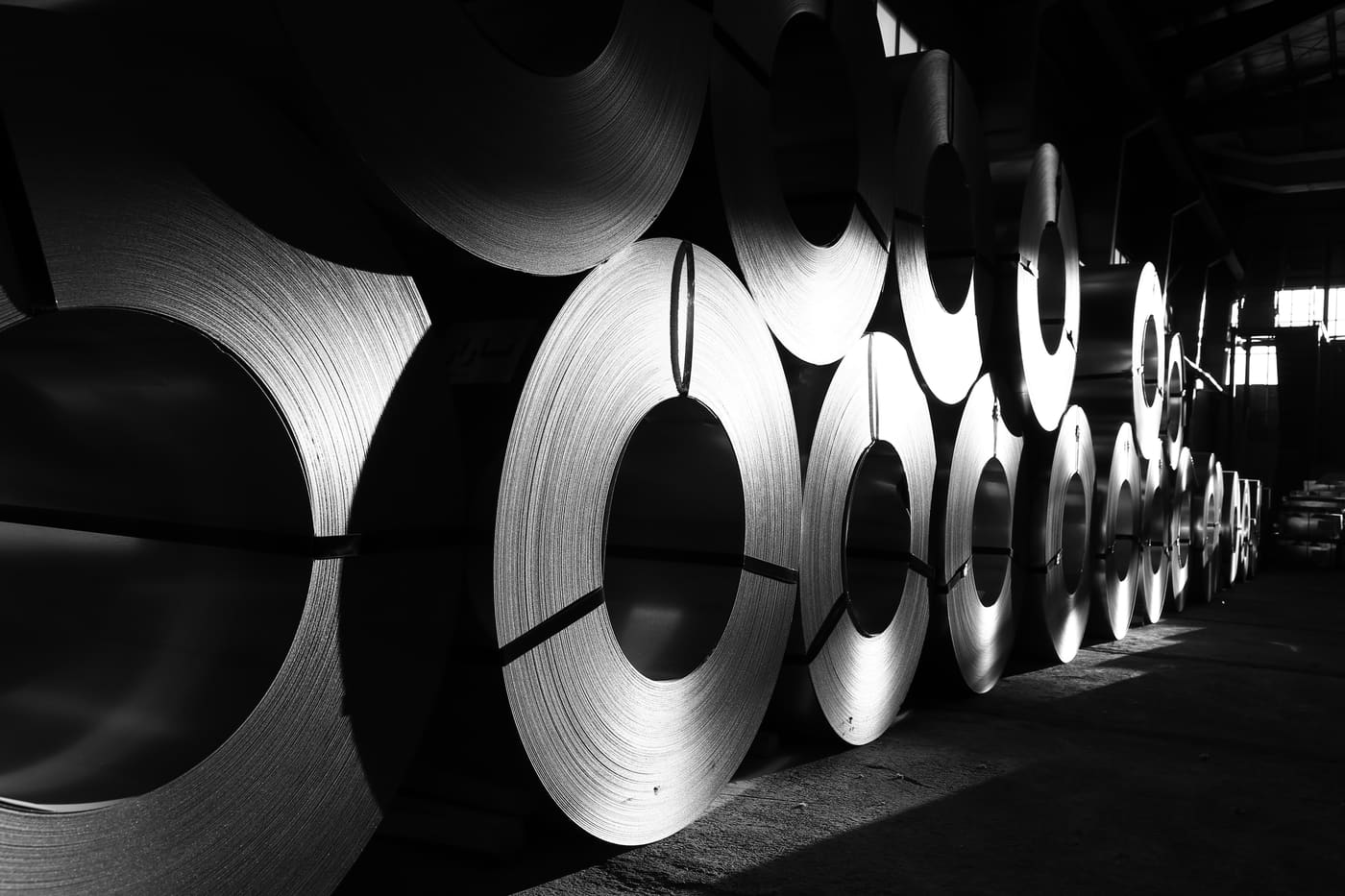 steel coils stacked in a warehouse
