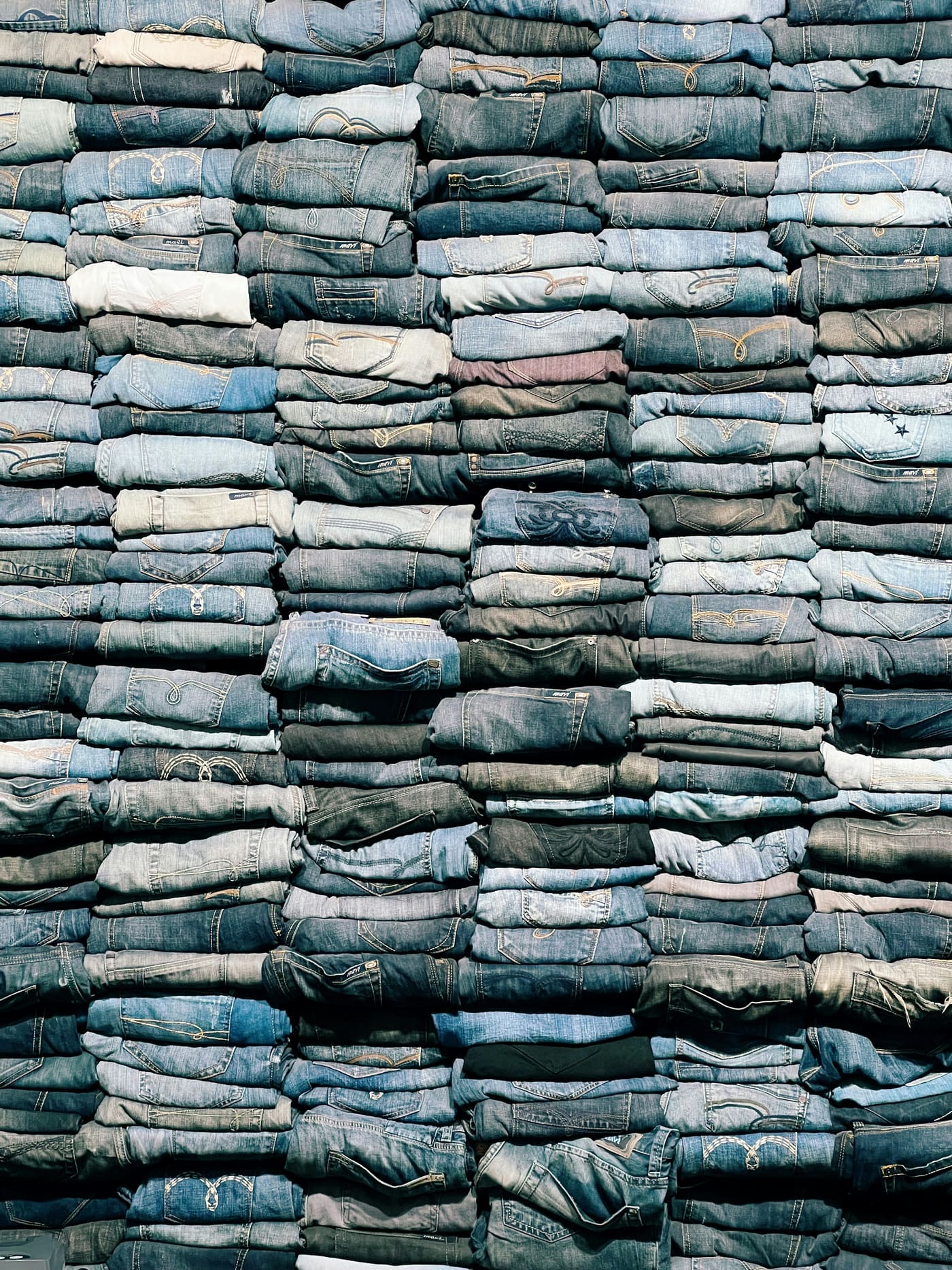folded denim stacked in a pile